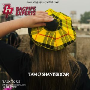 The image shows a Tam O'Shanter, a traditional Scottish hat featuring a round, woolen design with a central pom-pom.